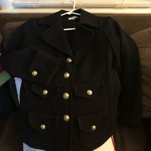 Black blazer with gold button detail.